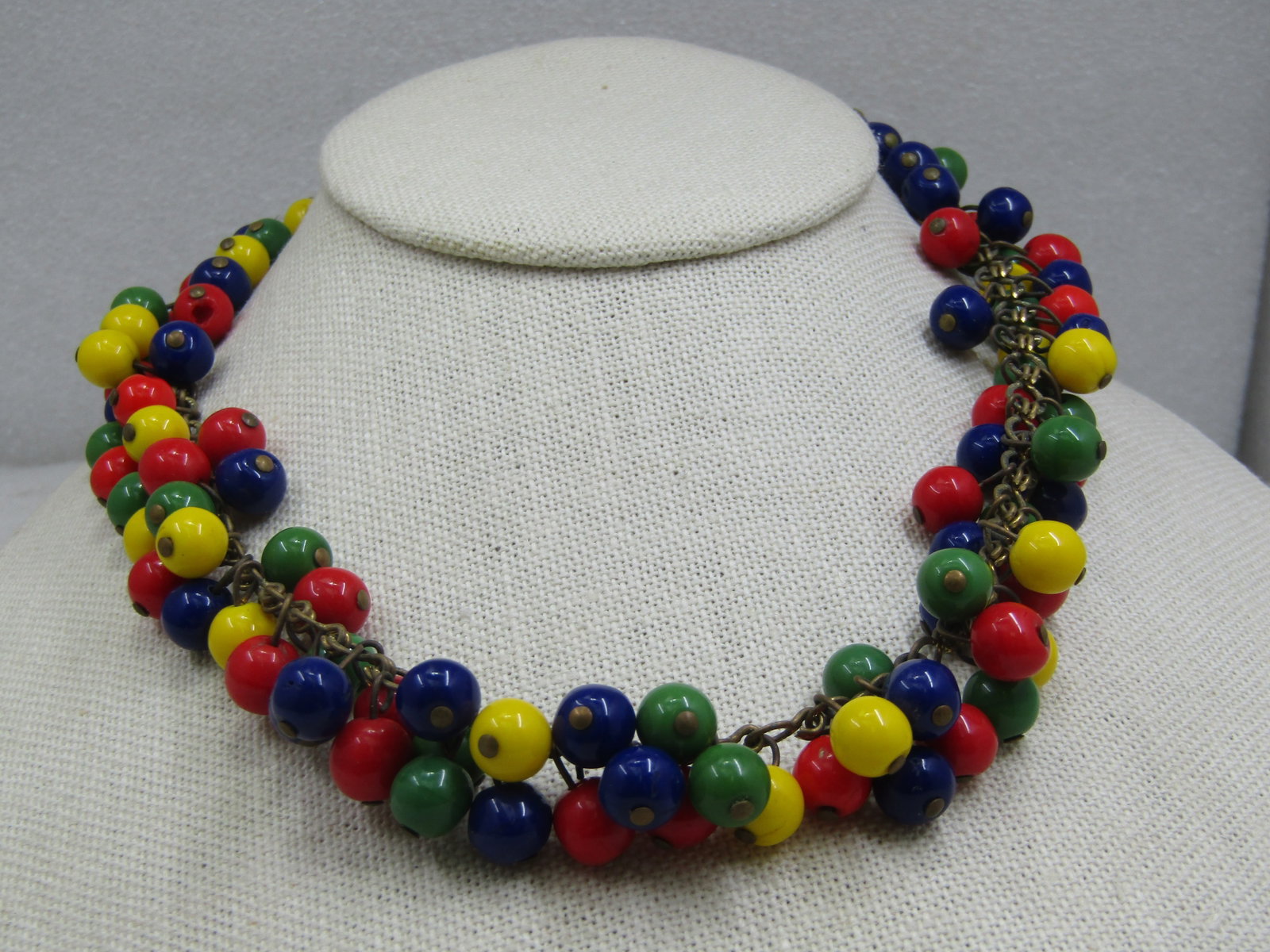 1930's Czech Harlequin Glass Beaded Necklace, Dangle, 16": 1930's Czech Harlequin Glass Beaded Necklace, Dangle, 16". Beads are in the 7mm to 8mm size and not perfectly round. This is a dangled beaded necklace where red, green, yellow, and blue beads dangle