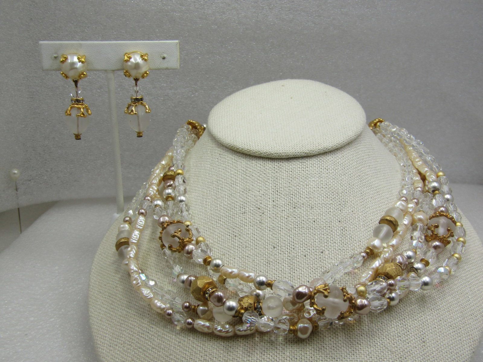 Vintage Liz Claiborne Faux Pearl, Gold Beaded Necklace & Earrings Set, Multi-Strand, 1980's: Vintage Liz Claiborne Faux Pearl, Gold Beaded Necklace, Multi-Strand, 1980's. Five stgrands with matching clip earrings. 17.5" long including extender chain. This is a mix of faceted 5.5mm clear