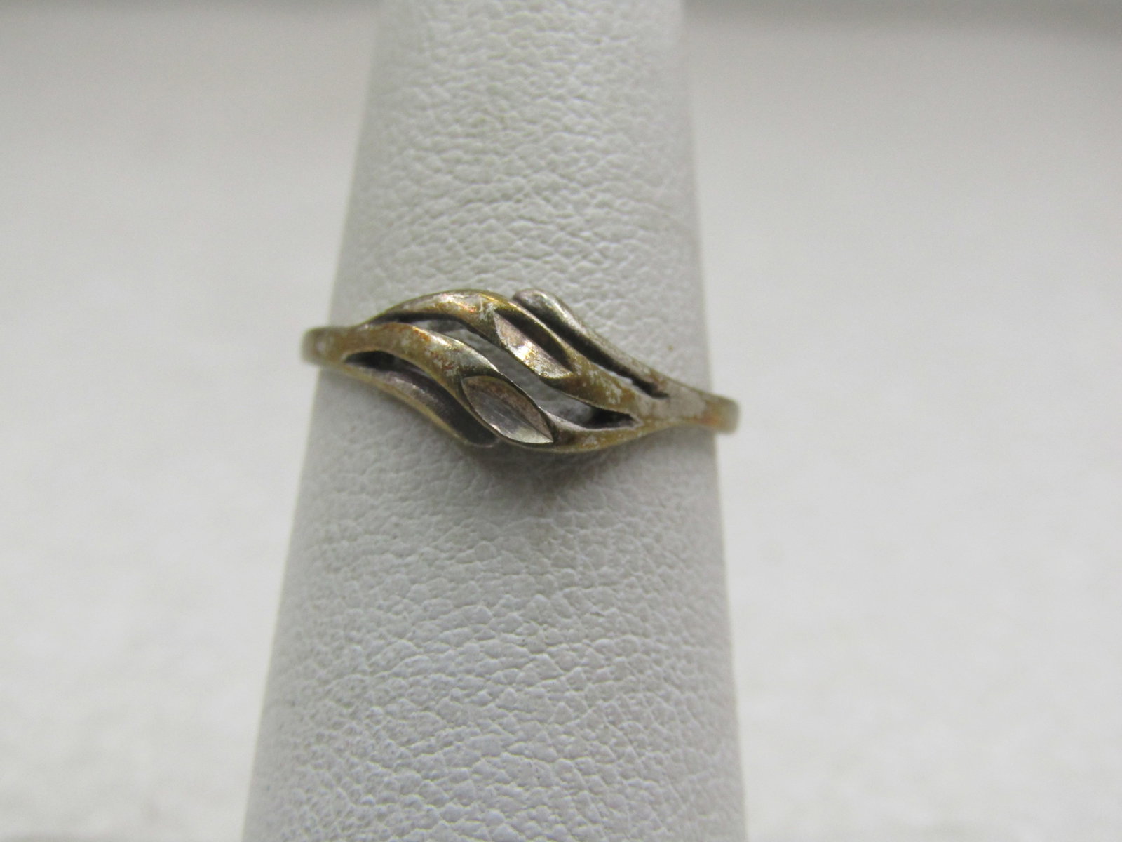 Vintage Sterling Domed Diamond Cut Ring, Sz. 6, Signed UTC: Vintage Sterling Domed Diamond Cut Ring, Sz. 6, Signed UTC. Age is estimated and 1960's-1970's. It has diagonal sweeps with diamond cut accents over the top fo the finger with open area around those