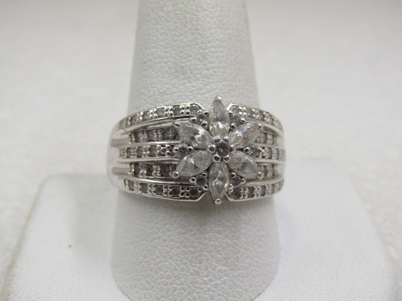 Vintage Sterling Wide Blossom CZ Ring, Sz. 11.5, Signed: Vintage Sterling Wide Blossom CZ Ring, Sz. 11.5, Signed SU .925 and CZ. There are five tiered bands over the top of the finger that are appx. 11.5mm down the finger at center and taper to 9mm where