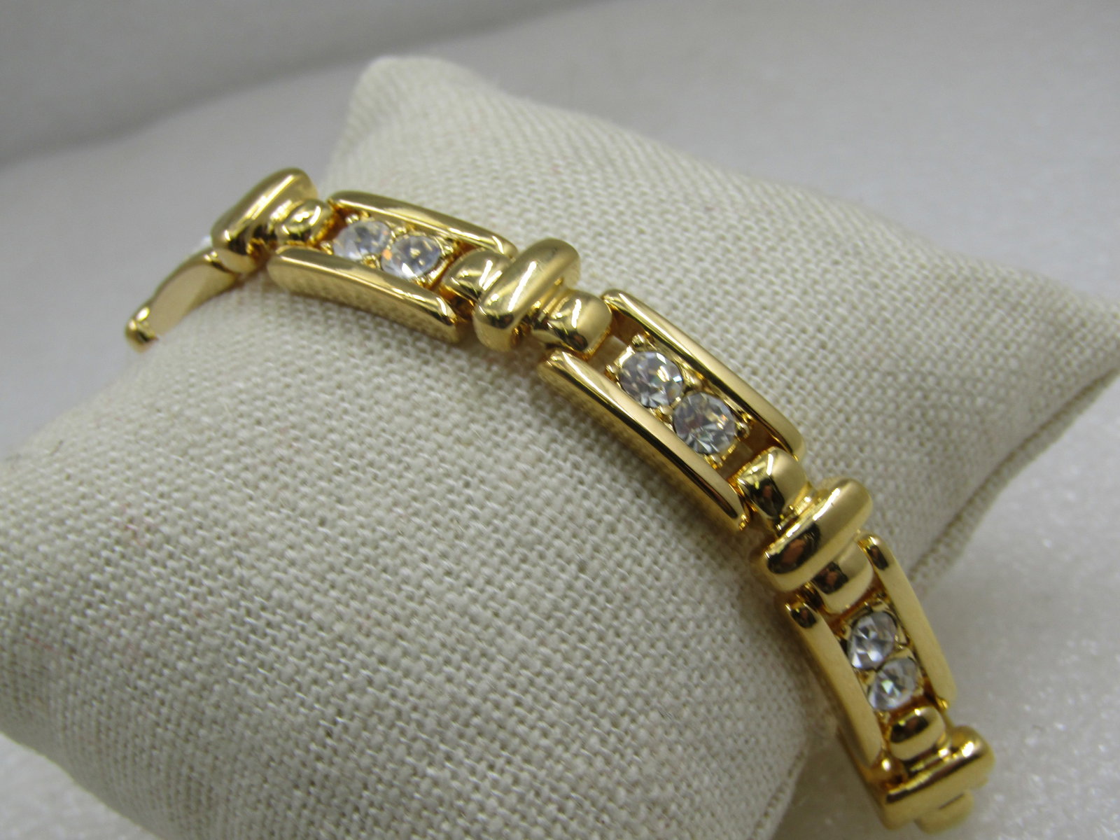 Vintage Joan Rivers Rhinestone Bracelet, 7.75": Vintage Joan Rivers Rhinestone Bracelet, 7.75" and 8.5mm wide. each links has two round rhinestones set with open area to the side of each stone and a vertical bar connector link between each link.