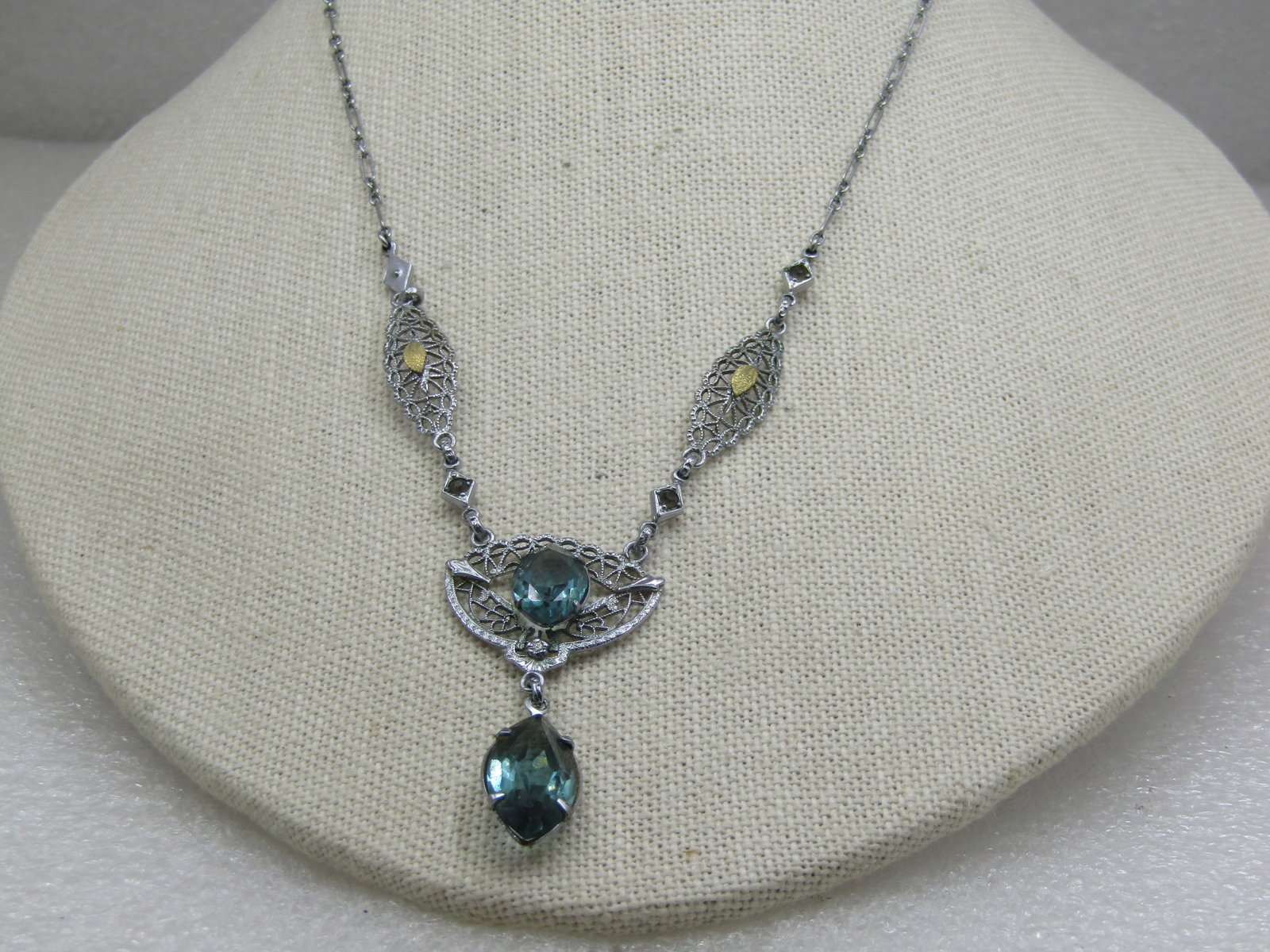 Modern Art Deco Rhinestone Filigree Lavalier Necklace, 16": Modern Art Deco Rhinestone Filigree Lavalier Necklace, 16". 1.75" filigree drop with two large aqua rhinestones - marquise - one is 12mm by 8mm and the other 18mm by 10mm. The filigree links across