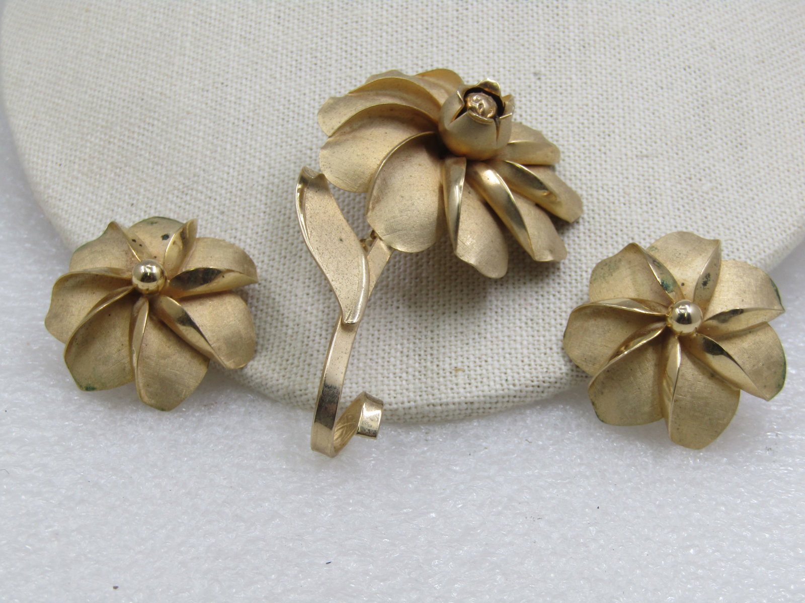 Vintage Floral Stem Brooch & Clip Earrings, 1960's. 3": Vintage Floral Stem Brooch & Clip Earrings, 1960's. 3" with nearly 1.5" Clip earrings, The blossom has textured and smooth finish with a raised center a. the brooch has a smooth curled stem and one