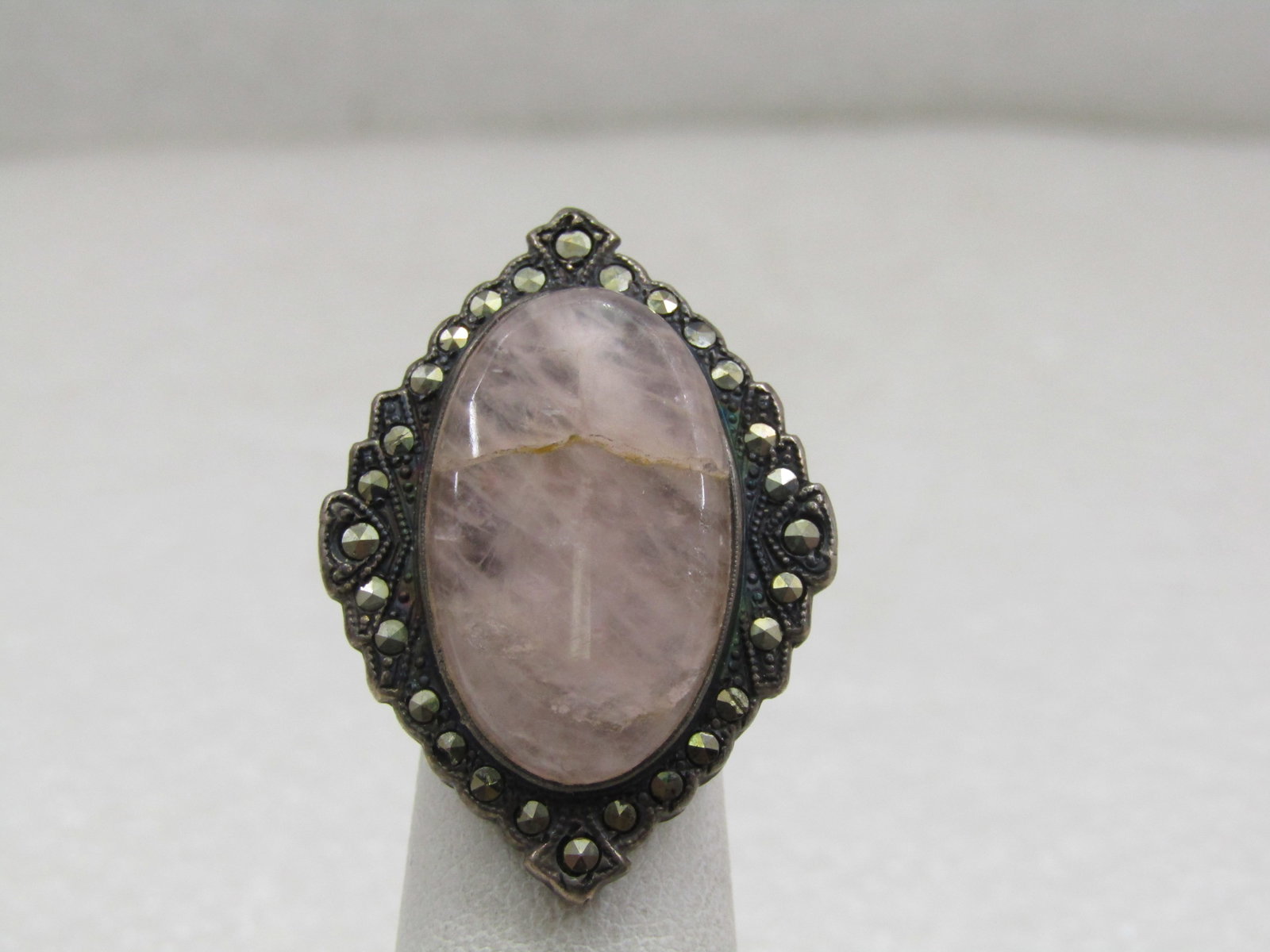 Vintage Sterling Quartz Marcasite Ring, Sz. 3, Signed Uncas, early 1900's: Vintage Sterling Quartz Marcasite Ring, Sz. 3, Signed Uncas, early 1900's. This ring has a large quartz stone that is appx. 25mm by 15mm bezel-set over a wide base that has marcasites around the quart