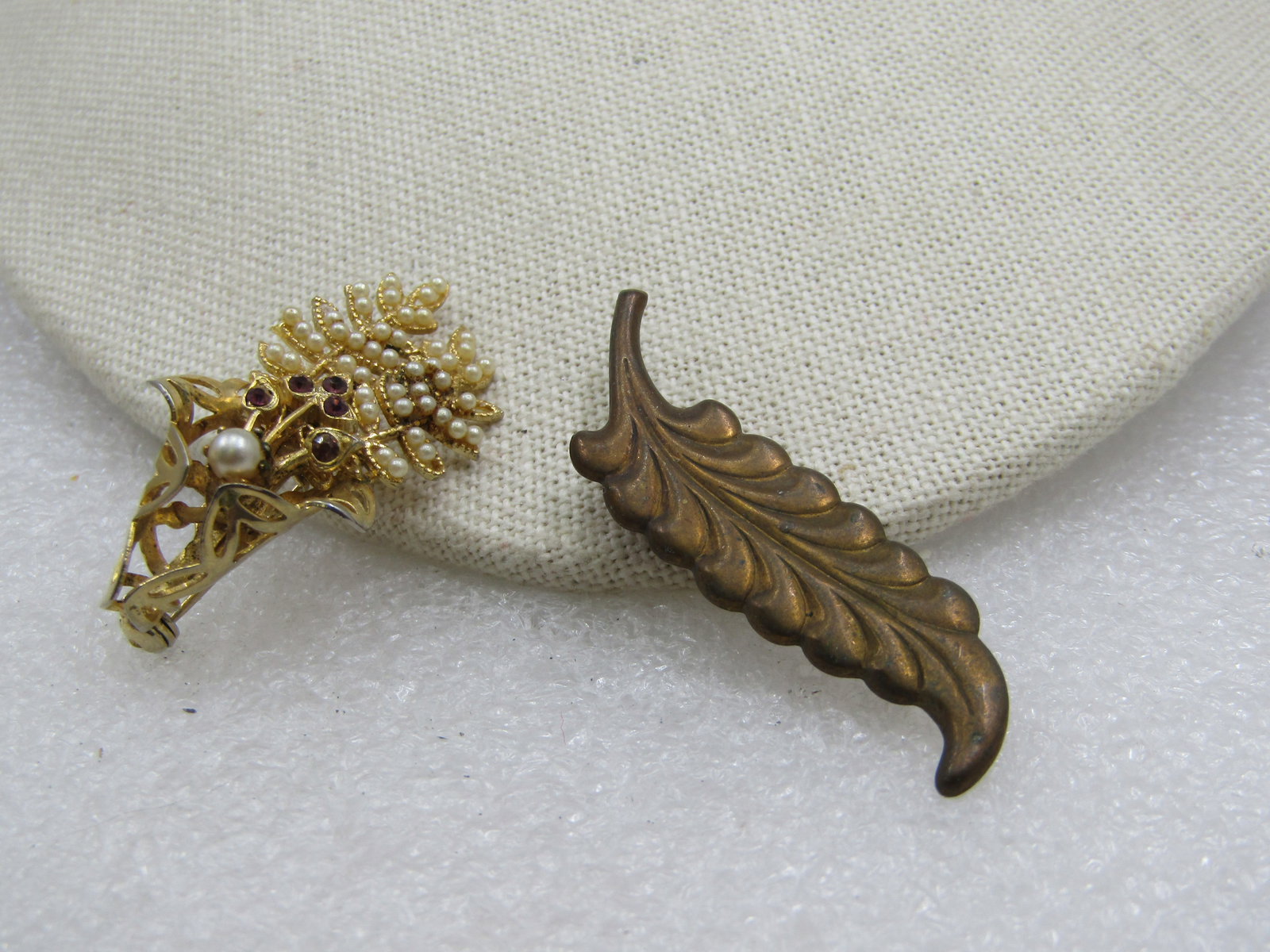Vintage Pair of Leaf Brooches, One with Faux Pearls/Rhinestones, 1930/s-1950's: Vintage Pair of Leaf Brooches, One with Faux Pearls/Rhinestones, 1930/s-1950's. The first is a filigree base wrap with two leaves coming out of the wrap with seed pearls throughout and rhinstones