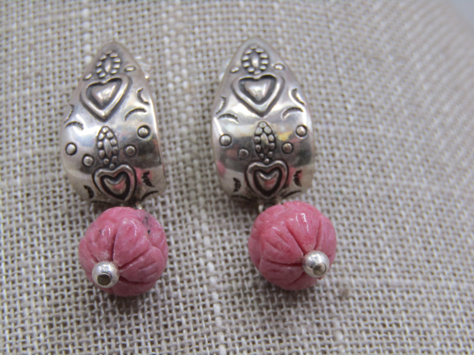 Vintage Sterling Southestern Rhodonite Drop Earrings, Carolyn Pollack Relios 1.5": Vintage Sterling Southestern Rhodonite Drop Earrings, Carolyn Pollack Relios 1.5". Curved heart stamped southwestern design tapered from 4mm at top to 11mm at the bottom with a carved rhondite