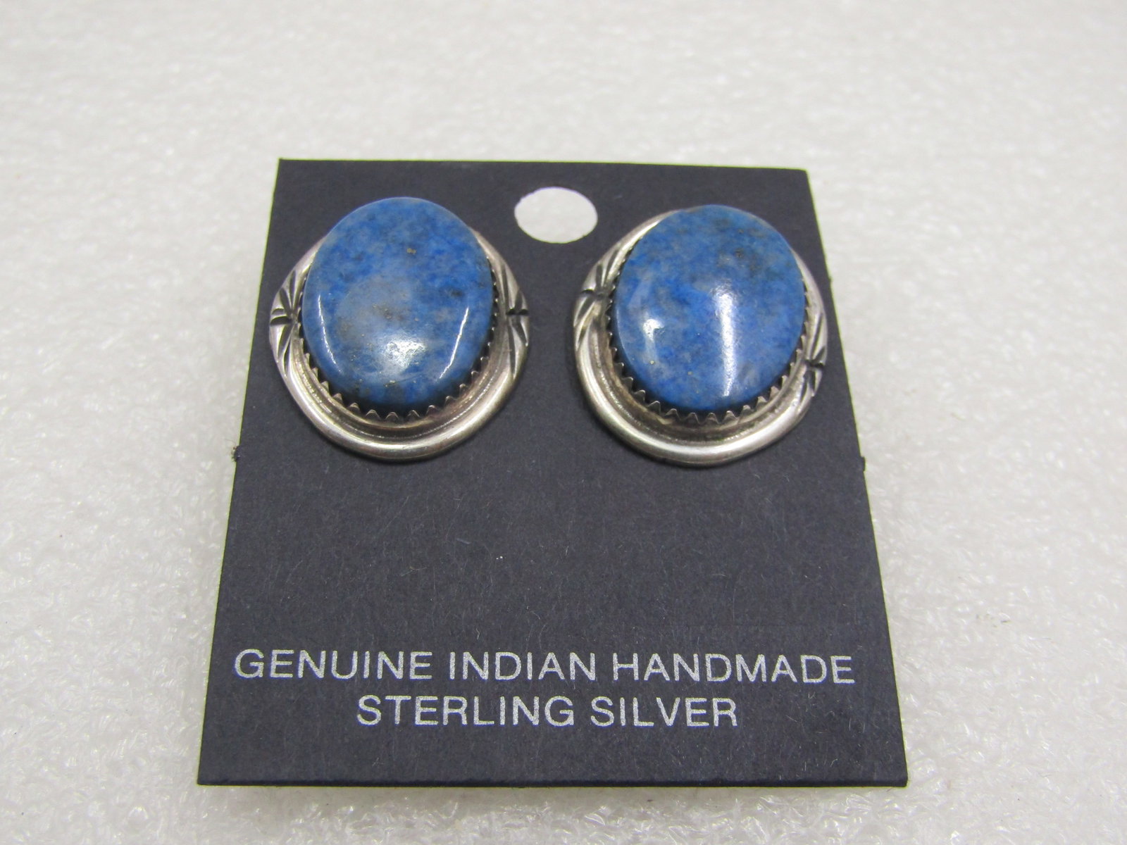 Sterling Silver Southwestern Lapis Lazuli Earrings, Pierced, 1": Sterling Silver Southwestern Lapis Lazuli Earrings, Pierced, 1" by 3/4". Oval sterling hand made sterling silver southwestern earrings. The stones are appx. 18mm by 13mm sawtooth bezel-set on a wider