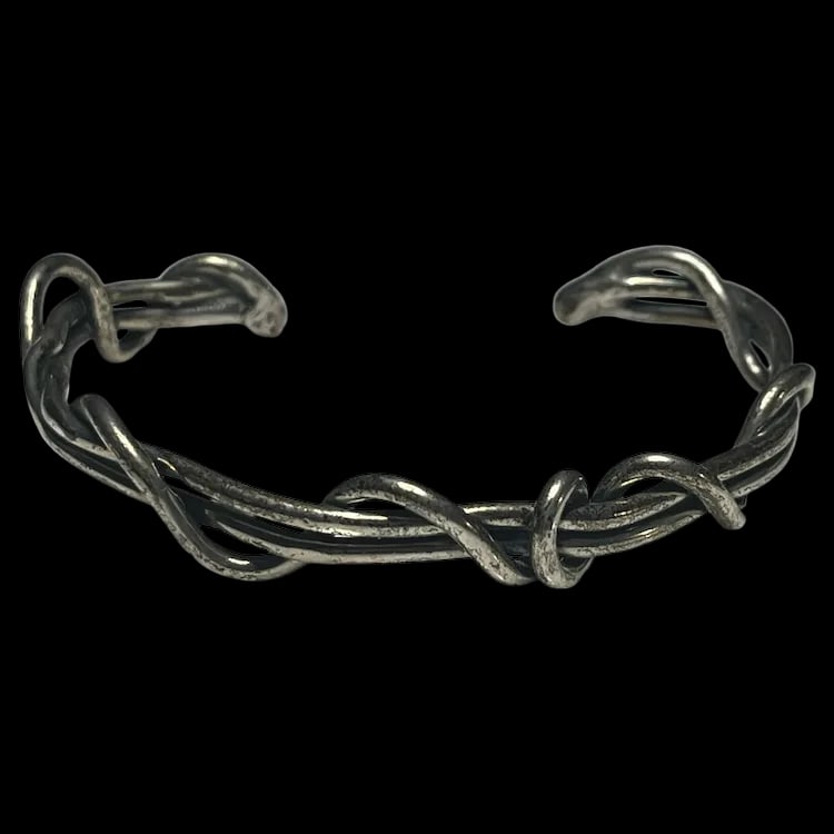 Estate Sterling Silver Wrapped Vine Cuff Bracelet: Title: Estate Sterling Silver Wrapped Vine Cuff Bracelet Description: Estate Sterling Silver Wrapped Vine Cuff Bracelet Hallmarked Sterling Weighs 18.9 grams Measures 2 x 2.5 inches Reserve: $95.00