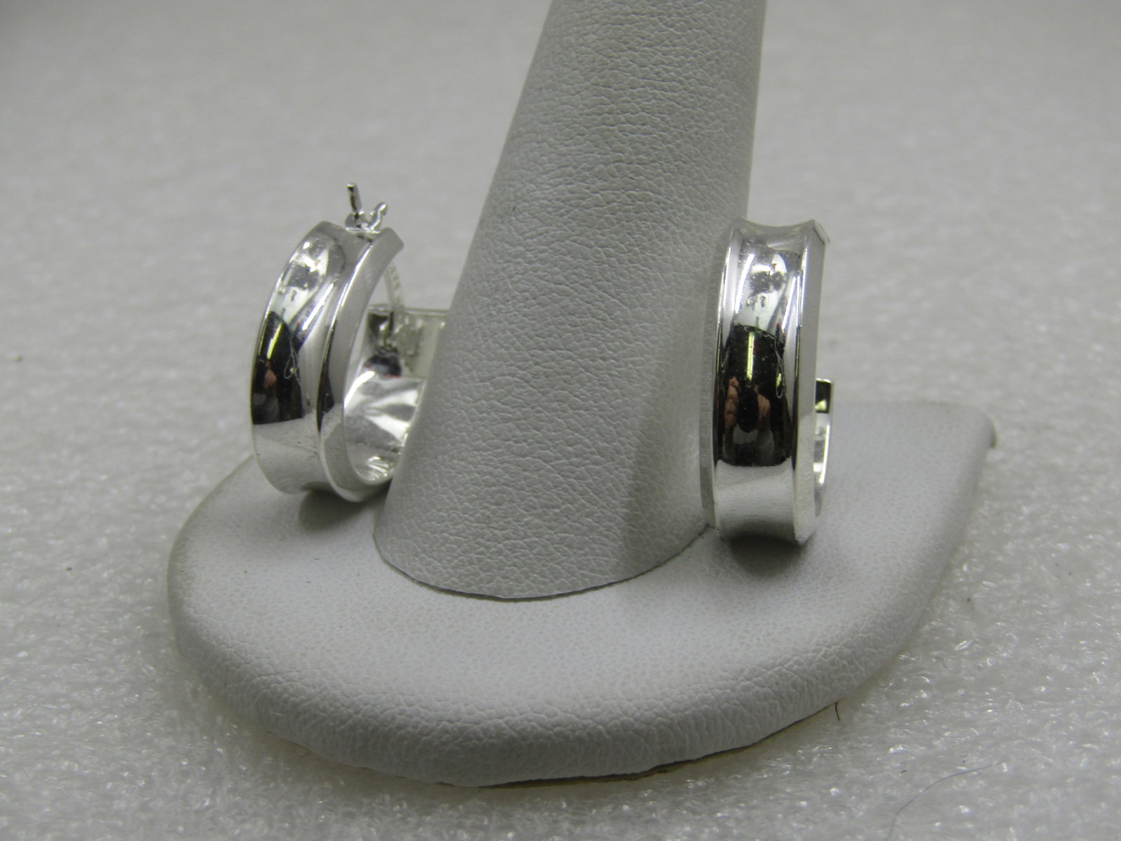 Vintage Sterling 7mm Hoop Pierced Earrings, Signed JCM: Vintage Sterling 6mm Wide earrings with a depressed around the center of the hoop The hoop is appx. 3/4" long. Marked .925, tested, and weight is appx. 3.99 gr. JCM is Jacmel Mauritius. Post