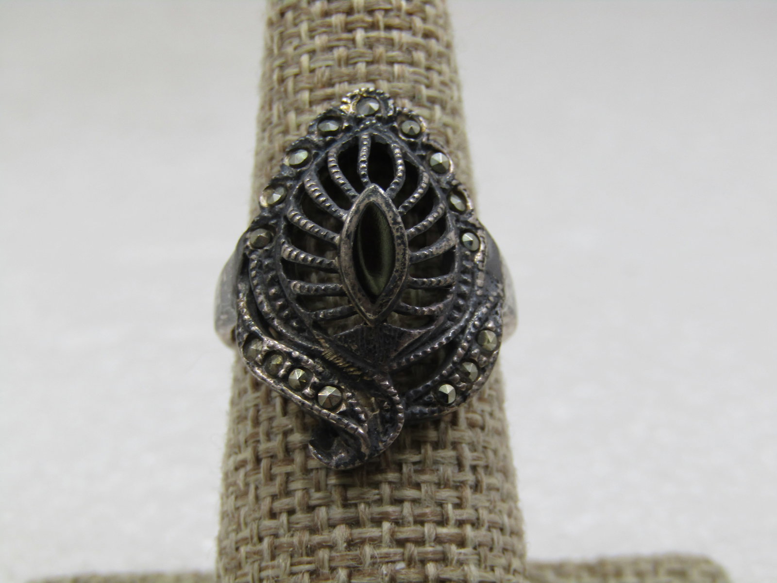 Vintage Sterling Onyx Leaf Marcasite Ring, Sz. 7.75: Vintage Sterling Onyx Leaf Marcasite Ring, Sz. 7.75, Signed G, 1970's-1980's. Open leaf design domed with a cateye onyx on top that is in an appx. 8mm y 3.5mm bezel. There is a marcasite frame around 