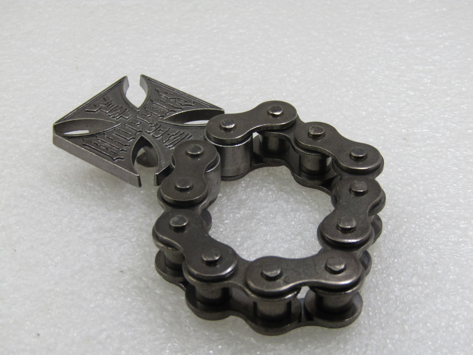 West Coast Choppers Bottle Opener, on Chain.: West Coast Choppers Bottle Opener, on Chain. 4: from top to bottom and appx. 1.5" wide. Has a motorcycle style links chain which makes it easy to hang or to carrwith with you. Biker appeal. Age is