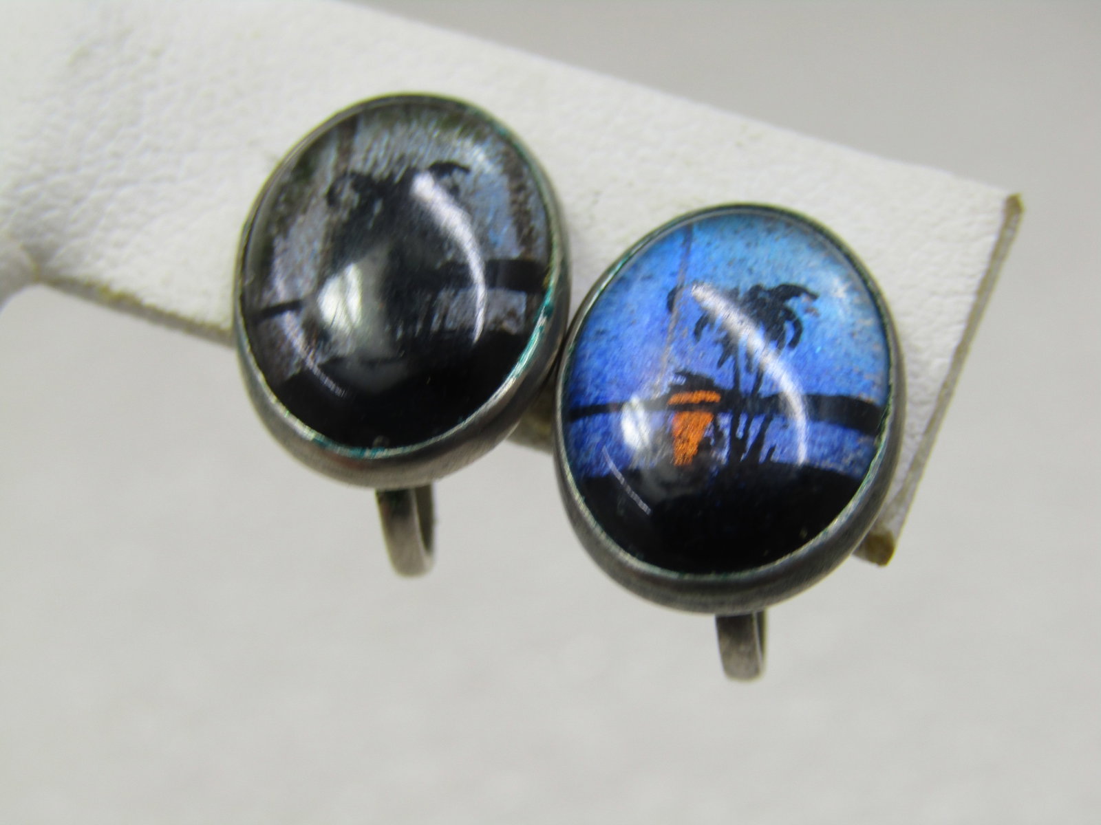 Vintage Morpho Beach Sunset Earrings, Screwback, 1940's-1950's: Vintage Morpho Beach Sunset Earrings, Screwback, 1940's-1950's. 5/8" tall and 1/2" wide with the shimmery blue butterfly wing background , coppery sunset and palm tree and beach sesign. One earrings