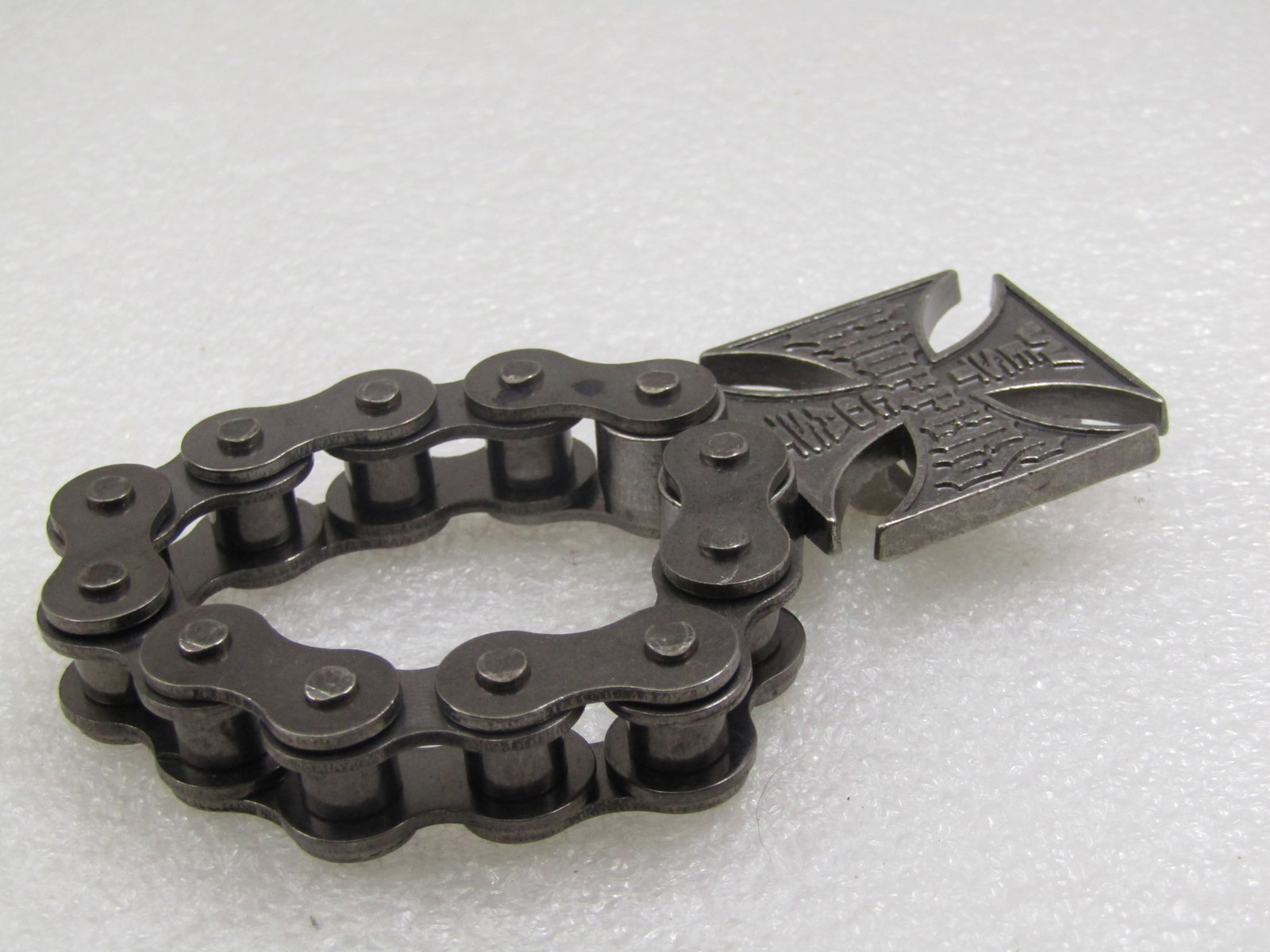 West Coast Choppers Bottle Opener, on Chain.: West Coast Choppers Bottle Opener, on Chain. 4: from top to bottom and appx. 1.5" wide. Has a motorcycle style links chain which makes it easy to hang or to carrwith with you. Biker appeal. Age is