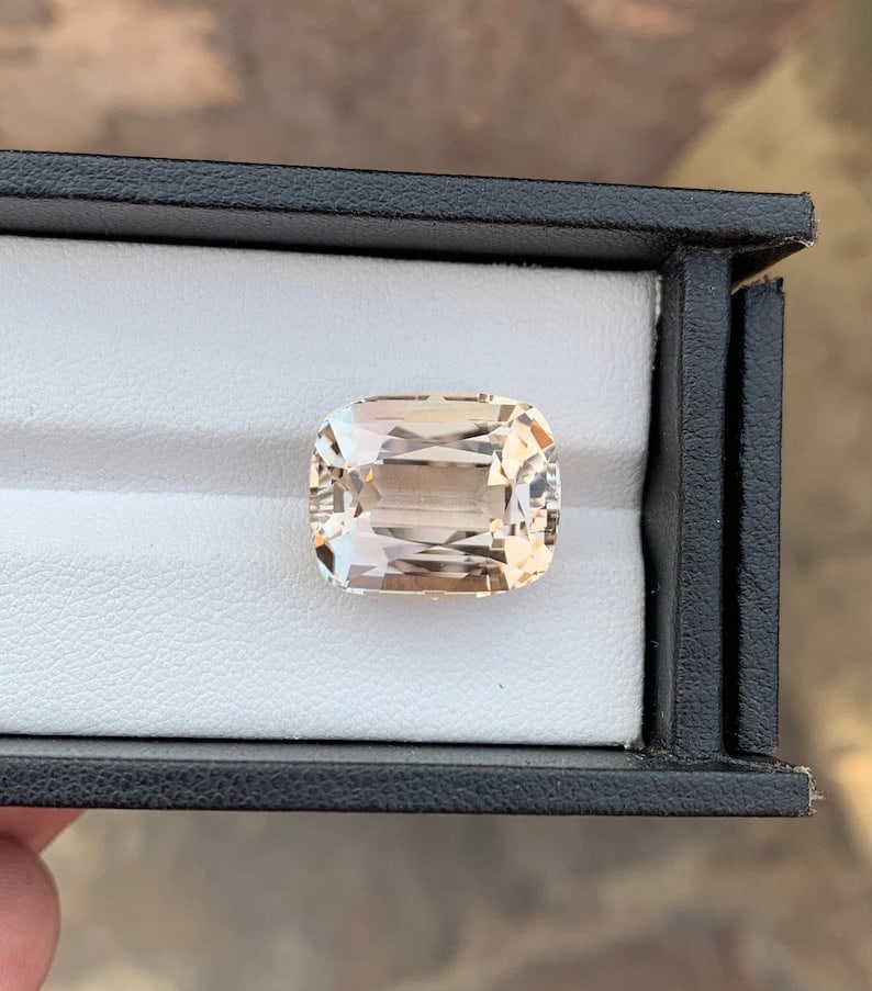 21.40 Carat Sherry Topaz Gemstone: Faceted Cushion Cut Stone: Title: 21.40 Carat Sherry Topaz Gemstone: Faceted Cushion Cut Stone Description: This Beautiful Sherry Color Topaz, expertly fashioned into a Faceted Long Cushion Shape, is the perfect size for