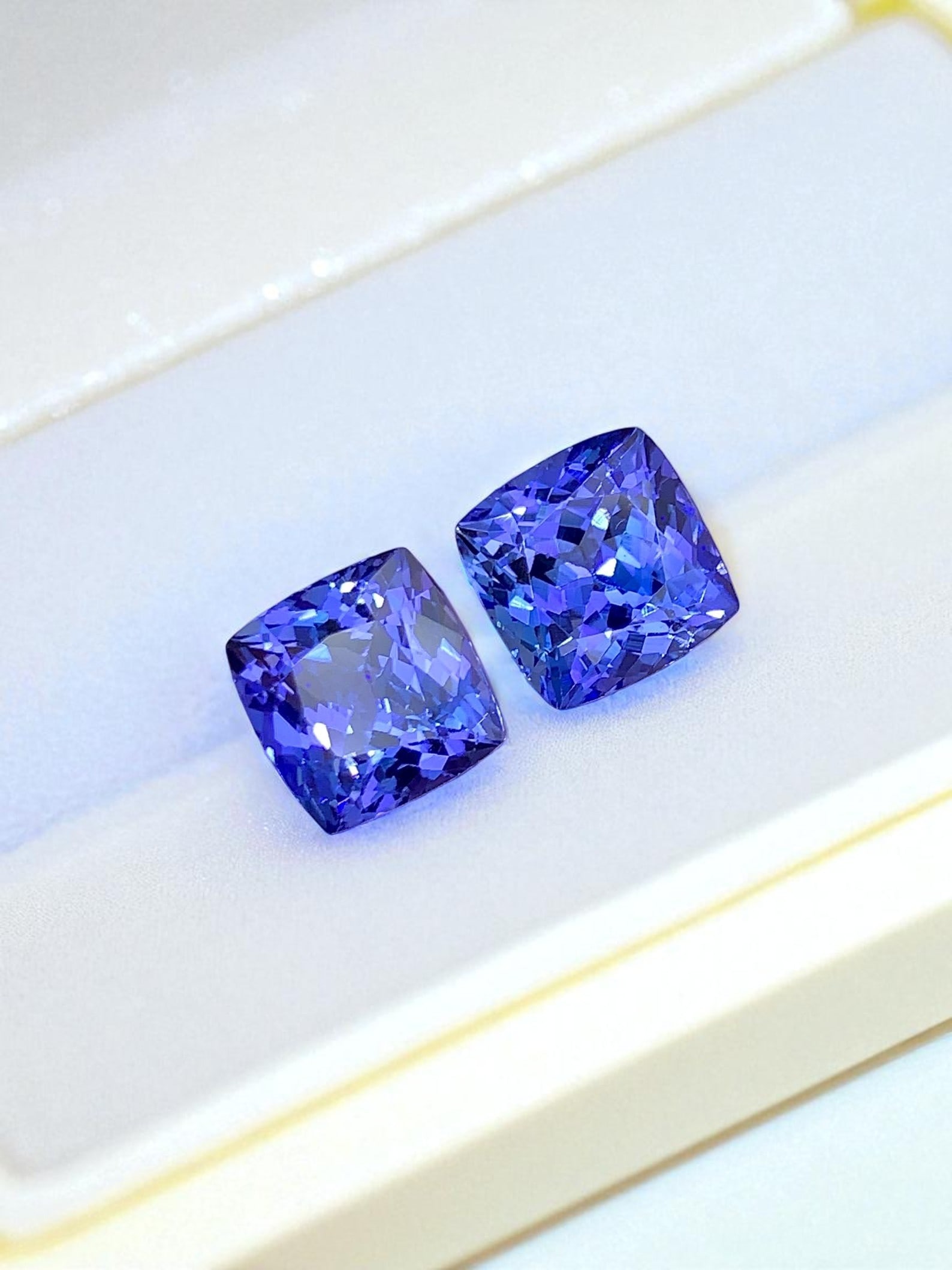 Natural Tanzanite Gemstones Pair, AAA Grade Tanzanite Loose Stones: Title: Natural Tanzanite Gemstones Pair, AAA Grade Tanzanite Loose Stones Description: Dimensions (mm) 8 x 8 x 5 mm Weight (cts) 5.75 Treatment Heat Treatment Shape Cushion Colours Description