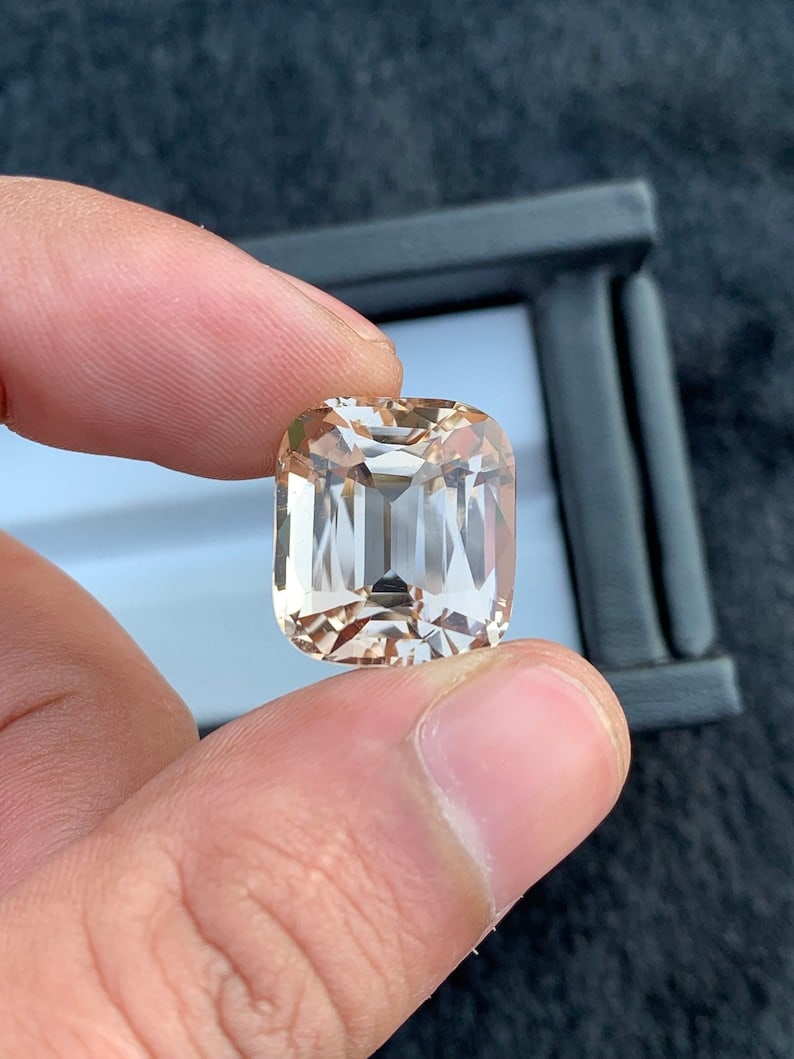 24.70Ct Sherry Topaz Gemstone: Faceted Cushion Cut: Title: 24.70Ct Sherry Topaz Gemstone: Faceted Cushion Cut Description: Gemstone: Topaz Carat weight: 24.70 Welcome to our Etsy shop, where the magic of handmade craftsmanship meets the timeless