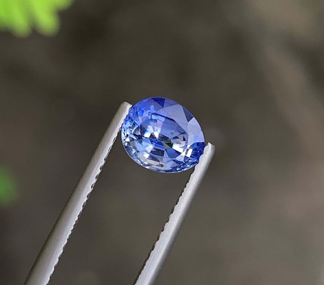 AIG Certified Faceted Blue Sapphire: 1.86 Carat Bi Color Oval Cut Gemstone: Title: AIG Certified Faceted Blue Sapphire: 1.86 Carat Bi Color Oval Cut Gemstone Description: Gemstone: Sapphire AIG Certified Natural Sapphire Faceted Loose Blue Color Sapphire Oval Cut For Jeweller