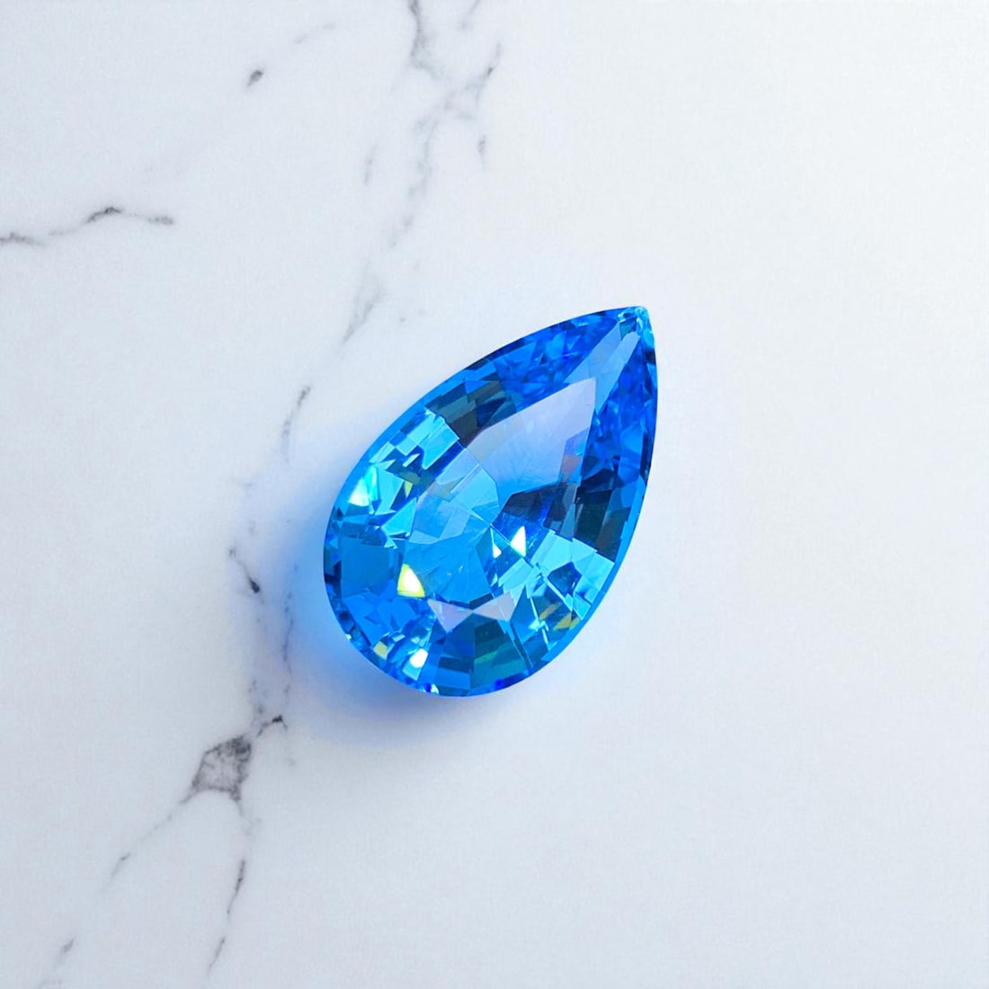 Swiss Blue Topaz Gemstone, Natural Topaz Necklace Stone, Pear Shape Topaz: Title: Swiss Blue Topaz Gemstone, Natural Topaz Necklace Stone, Pear Shape Topaz Description: Dimensions (mm) 22 x 14 x 10.3 mm Weight (cts) 22.75 Treatment Heat Treatment Shape Pear Colours