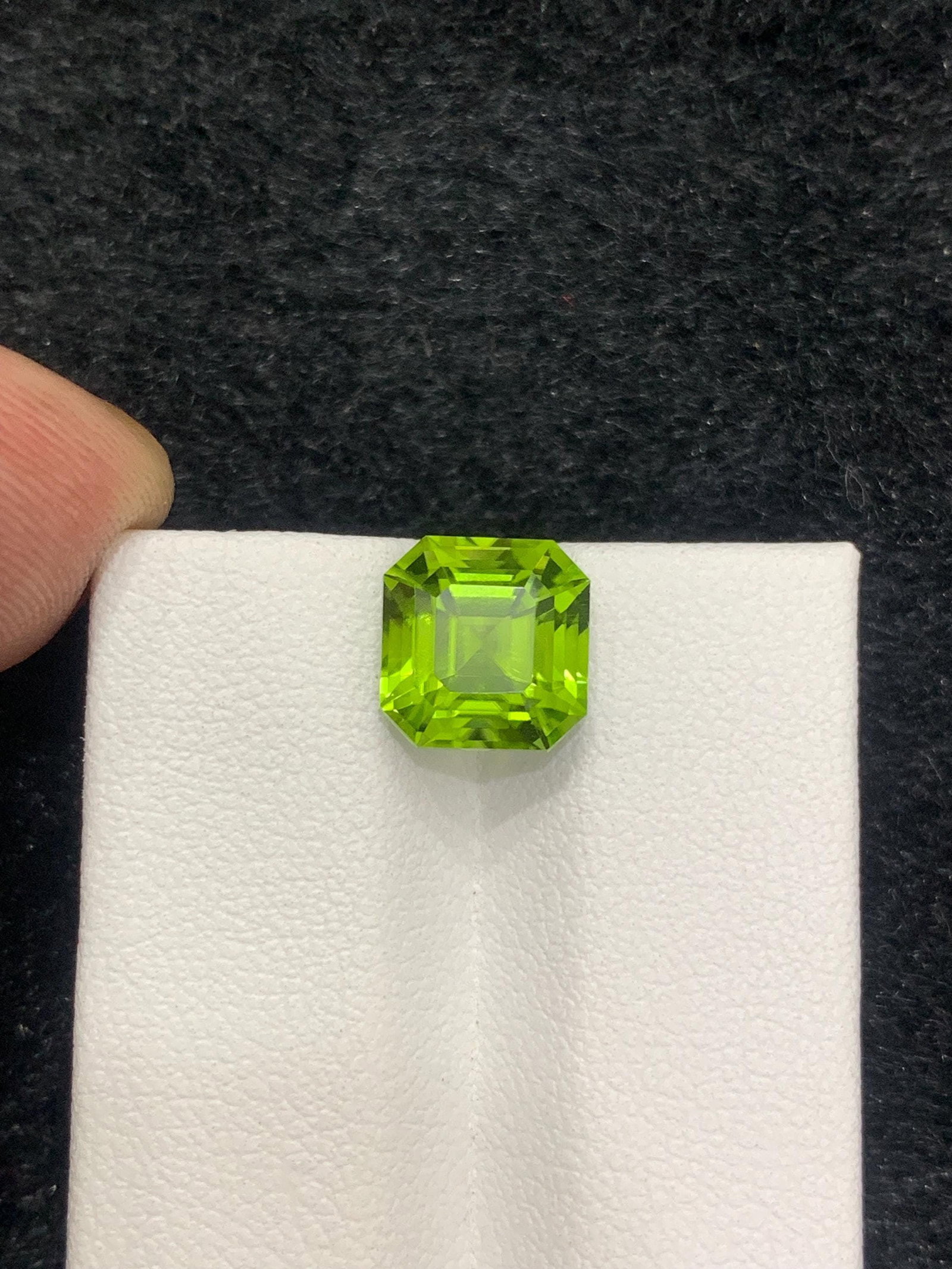 Apple Green Peridot Gemstone: 4.10 Carat Asscher Cut: Title: Apple Green Peridot Gemstone: 4.10 Carat Asscher Cut Description: Gemstone: Peridot Carat weight: 4.10 • Weight : 4.10 carat • Dimension : 8.8*8.2*7.2 mm • Color : Apple