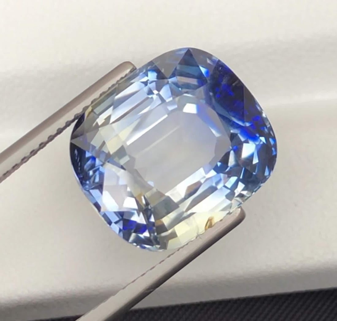 GRS Certified Faceted Bi Color Sapphire: 21.37 Carat Cushion Cut Gemstone: Title: GRS Certified Faceted Bi Color Sapphire: 21.37 Carat Cushion Cut Gemstone Description: Gemstone: Sapphire GRS Certified Faceted Bi Color Sapphire: 21.37 Carat Cushion Cut Gemstone Weight: 21.37