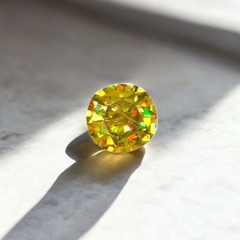 Full Fire Sphene Ring Stone, Natural Sphene Gemstone: Title: Full Fire Sphene Ring Stone, Natural Sphene Gemstone Description: Dimensions (mm) 10 x 10 x 5 mm Weight (cts) 2.75 Round VS Colours Description Full Fire Sphene Ring Stone, Natural Sphene