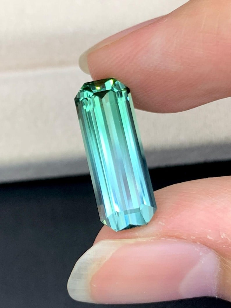 4.95 Carat Bi-Color Tourmaline Gemstone: Emerald Cut Blue Green Jewel: Title: 4.95 Carat Bi-Color Tourmaline Gemstone: Emerald Cut Blue Green Jewel Description: Gemstone: Tourmaline Carat weight: 4.95 : • Weight : 4.95 Carat • Dimension : 17.2*16.4*5 MM ̶