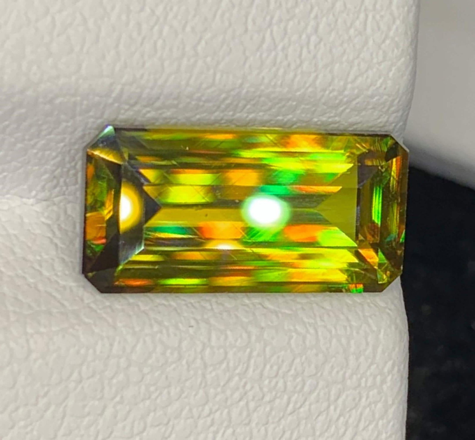 Natural Lustrous Sphene Gemstone: Multi Color Emerald Cut, 4.46 Carat: Title: Natural Lustrous Sphene Gemstone: Multi Color Emerald Cut, 4.46 Carat Description: Gemstone: Sphene Natural Lustrous Sphene Gemstone: Multi Color Emerald Cut Weight : 4.46 cts Dimensions : 13.2