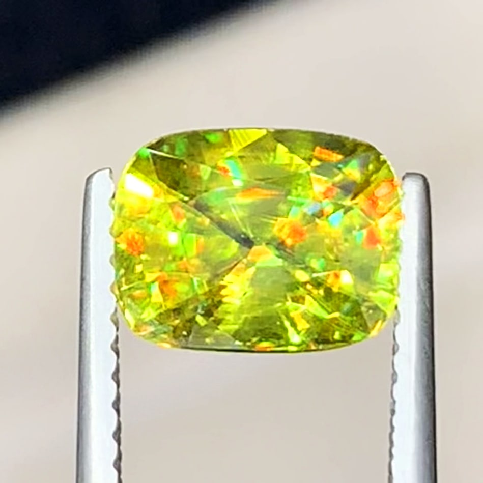 Full Fire Sphene Gemstone, Apple Green Sphene Ring Stone: Title: Full Fire Sphene Gemstone, Apple Green Sphene Ring Stone Description: Dimensions (mm) 8.5 x 7 x 5 mm Weight (cts) 2.25 Cushion Colours Description Full Fire Sphene Gemstone, Apple Green Sphene