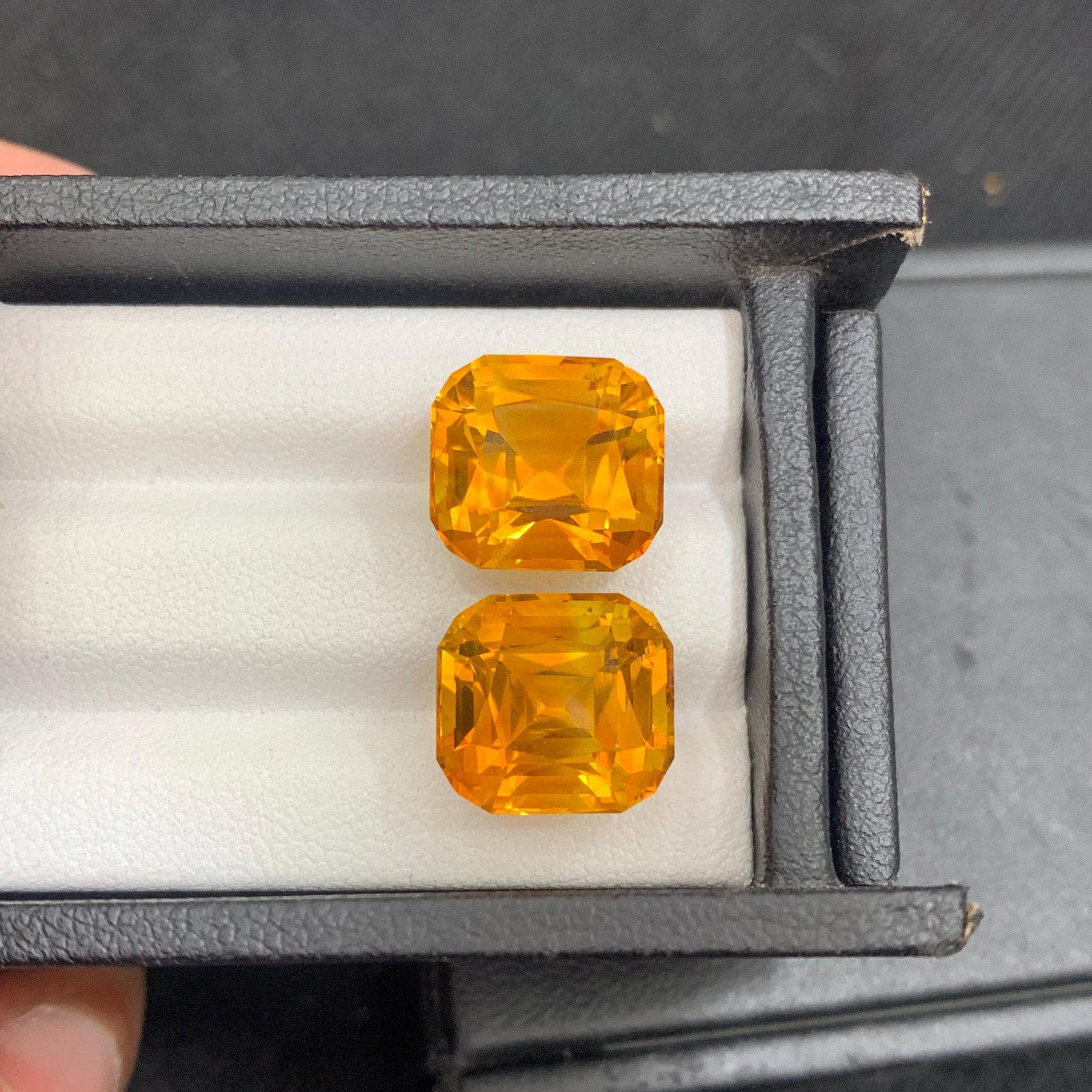 Madeira Citrine Gem Pair: 17.18 ct Orange Cushion Cut Stones: Title: Madeira Citrine Gem Pair: 17.18 ct Orange Cushion Cut Stones Description: Gemstone: Citrine Carat weight: 17 “Sunset in Your Hands! “ “A rare find, perfect for a statement