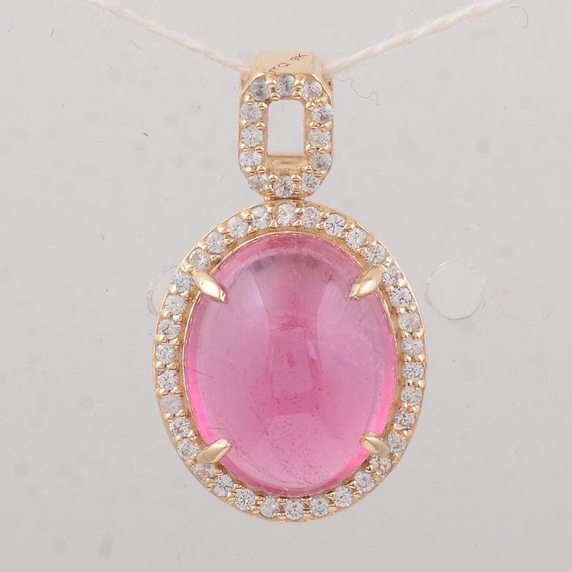 4.08 Ct Oval Tourmaline 9K Gold Pendant: 4.08 Total Carat Tourmaline 9K Gold Pendant Specifications: Total Weight 1.79 g Center Gemstone Tourmaline Gemstone Carat Weight 3.9 Carats Gemstone Measurements 11X9X5 mm Additional Gemstones White