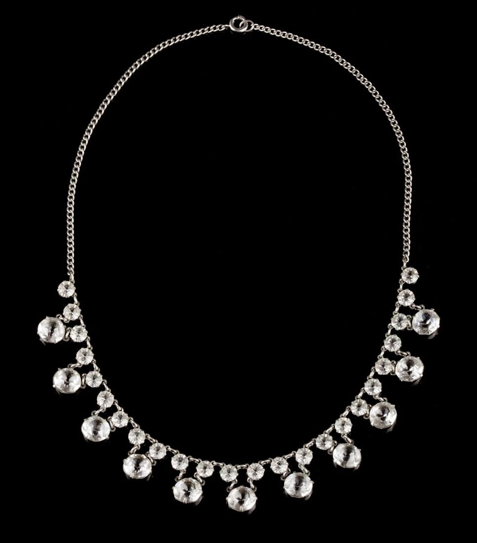 Art Deco Paste Dangle Necklace: Title:Art Deco Paste Dangle Necklace Description:Gorgeous construction with playful design in this Deco necklace of small and large round paste stones. Costume metal plated in white rhodium. Circa,