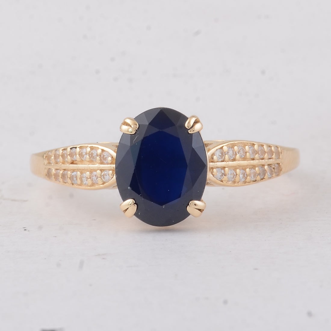 2.75 Ct Oval Sapphire 9K Gold Ring: 2.75 Total Carat Sapphire 9K Gold Ring Specifications: Total Weight 2.27 g Center Gemstone Sapphire Gemstone Carat Weight 2.63 Carats Gemstone Measurements 9X7X4.30 mm Additional Gemstones White