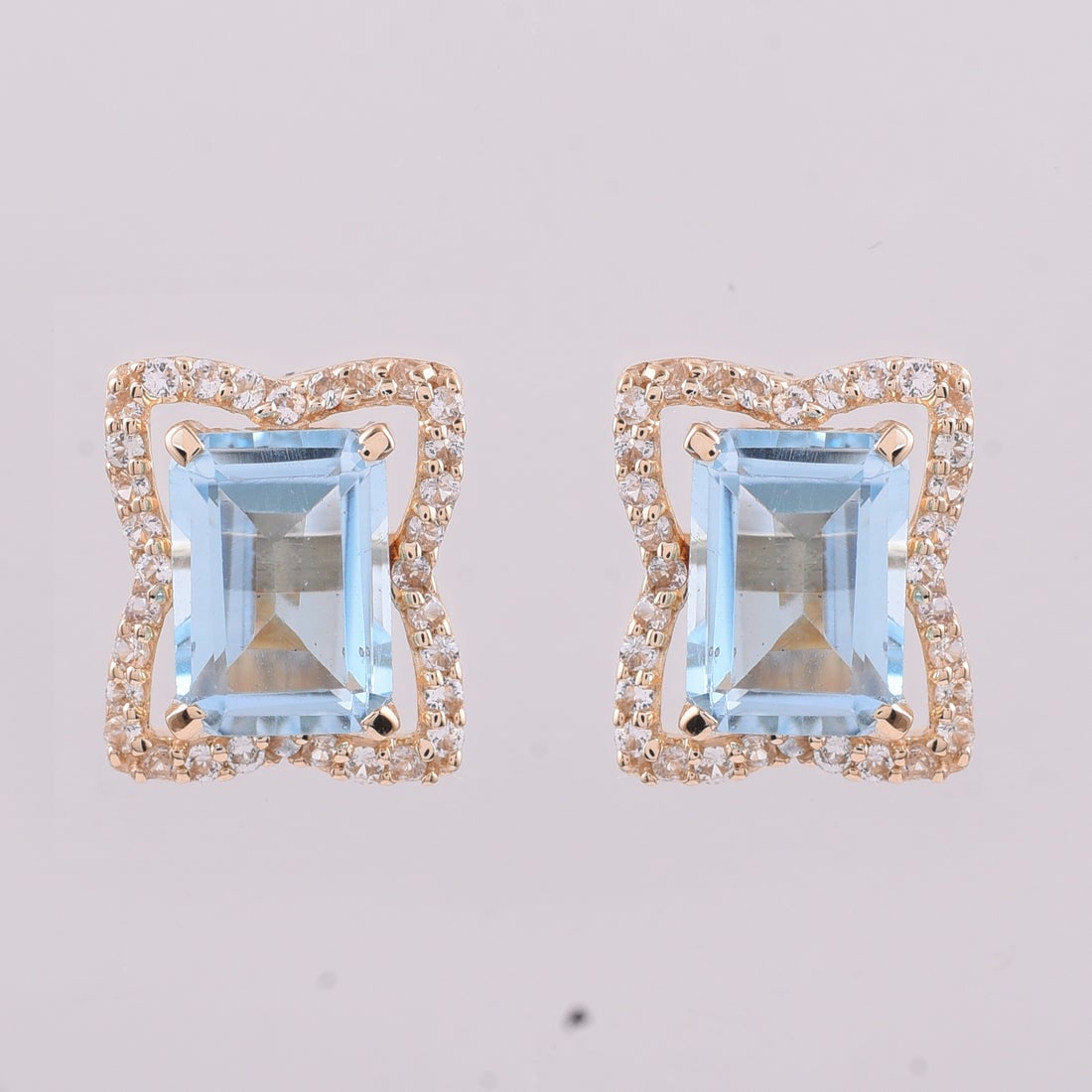 2.59 Ct Octagon Blue Topaz 9K Gold Earrings: 2.59 Total Carat Blue Topaz 9K Gold Earrings Specifications: Total Weight 1.931 g Center Gemstone Blue Topaz Gemstone Carat Weight 2.3 Carats Gemstone Measurements 7X5 mm Additional Gemstones White