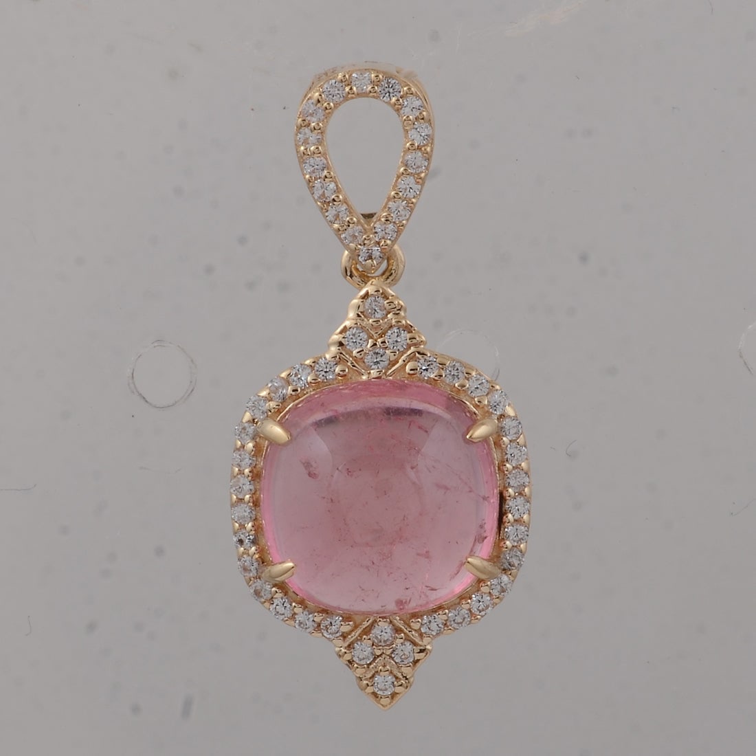 3.57 Ct Cushion Tourmaline 9K Gold Pendant: 3.57 Total Carat Tourmaline 9K Gold Pendant Specifications: Total Weight 1.75 g Center Gemstone Tourmaline Gemstone Carat Weight 3.36 Carats Gemstone Measurements 9X9X4.80 inch Additional Gemstones