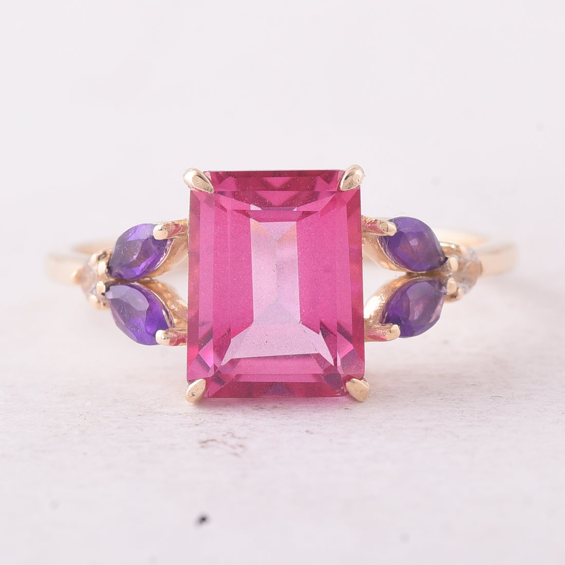 3.07 Ct Octagon Pink Topaz 9K Gold Ring: 3.07 Total Carat Pink Topaz 9K Gold Ring Specifications: Total Weight 2.241 g Center Gemstone Pink Topaz Gemstone Carat Weight 2.69 Carats Gemstone Measurements 9X7X4.80 mm Additional Gemstones