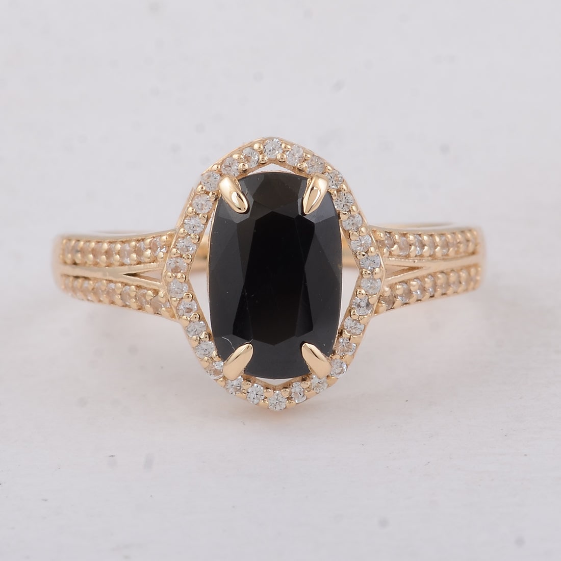 2.16 Ct Cushion Sapphire 9K Gold Ring: 2.16 Total Carat Sapphire 9K Gold Ring Specifications: Total Weight 2.42 g Center Gemstone Sapphire Gemstone Carat Weight 1.9 Carats Gemstone Measurements 9.30X6X3.50 mm Additional Gemstones White