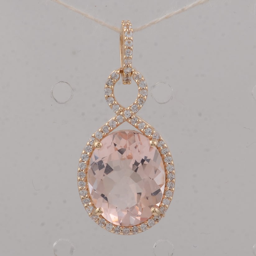 3.56 Ct Oval Morganite 9K Gold Pendant: 3.56 Total Carat Morganite 9K Gold Pendant Specifications: Total Weight 1.73 g Center Gemstone Morganite Gemstone Carat Weight 3.32 Carats Gemstone Measurements 11X9X5.60 mm Additional Gemstones
