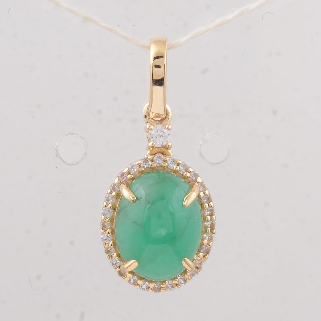 2.37 Ct Oval Emerald 9K Gold Pendant: 2.37 Total Carat Emerald 9K Gold Pendant Specifications: Total Weight 2.57 g Center Gemstone Emerald Gemstone Carat Weight 2.23 Carats Gemstone Measurements 9X7X4.60 mm Additional Gemstones White