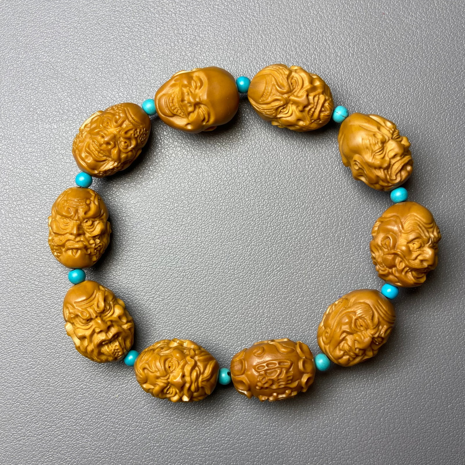 Chinese Olive Pit Hand Carved Double-sided 18 Arhat Bracelet Buddha Amulet: Title: Chinese Olive Pit Hand Carved Double-sided 18 Arhat Bracelet Buddha Amulet Description:Chinese Olive Pit Hand Carved Double-sided 18 Arhat Bracelet Buddha Amulet Contains 10 pieces, about 17