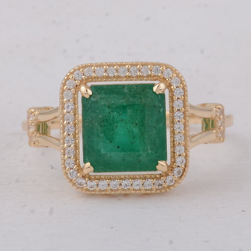 2.17 Ct Octagon Emerald 9K Gold Ring: 2.17 Total Carat Emerald 9K Gold Ring Specifications: Total Weight 2.52 g Center Gemstone Emerald Gemstone Carat Weight 1.98 Carats Gemstone Measurements 8X7.60X4.70 mm Additional Gemstones White