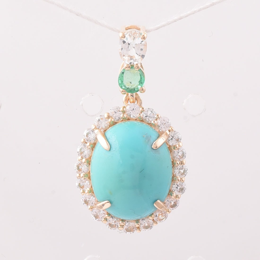 4.24 Ct Oval Turquoise 9K Gold Pendant: 4.24 Total Carat Turquoise 9K Gold Pendant Specifications: Total Weight 1.933 g Center Gemstone Turquoise Gemstone Carat Weight 3.37 Carats Gemstone Measurements 11.10X9.20X5 mm Additional Gemstones