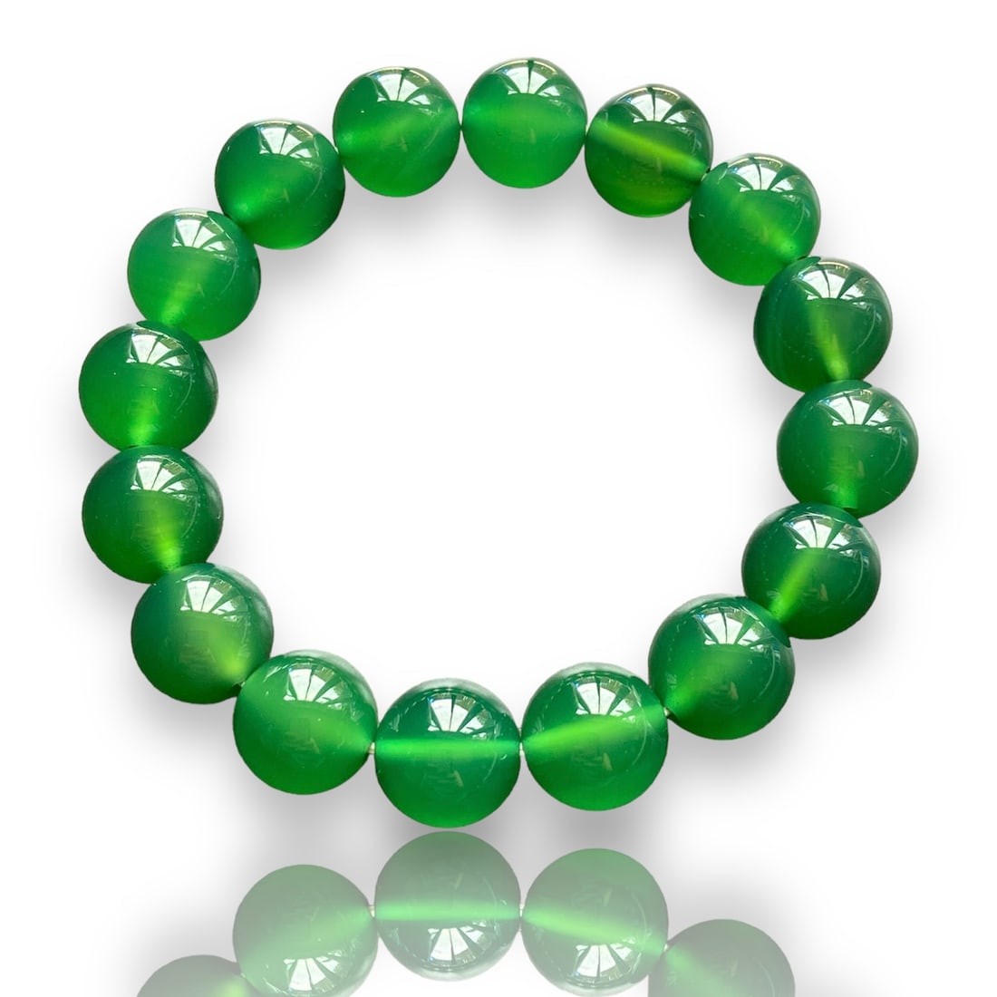 12mm Natural Imperial Green Chalcedony Jade Bead Bracelet: Title: 12mm Natural Imperial Green Chalcedony Jade Bead Bracelet Description:12mm Natural Imperial Green Chalcedony Jade Bead Bracelet This stunning accessory combines natural beauty with remarkable