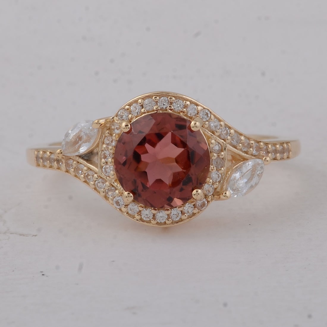1.96 Ct Round Tourmaline 9K Gold Ring: 1.96 Total Carat Tourmaline 9K Gold Ring Specifications: Total Weight 2.47 g Center Gemstone Tourmaline Gemstone Carat Weight 1.57 Carats Gemstone Measurements 7 mm Additional Gemstones White Sapphire