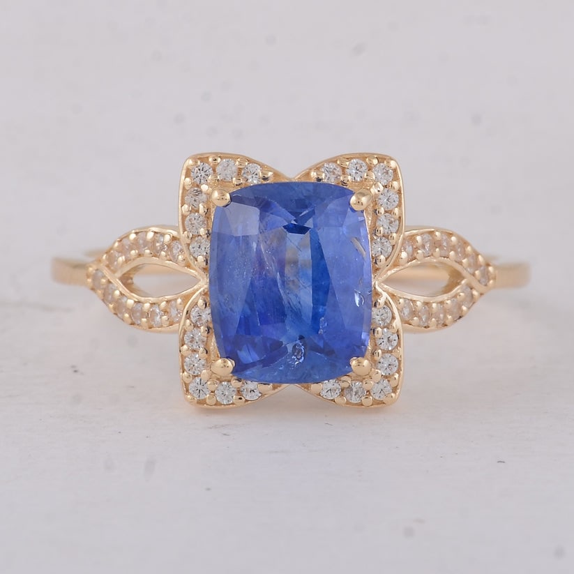 2.44 Ct Cushion Sapphire 9K Gold Ring: 2.44 Total Carat Sapphire 9K Gold Ring Specifications: Total Weight 2.29 g Center Gemstone Sapphire Gemstone Carat Weight 2.24 Carats Gemstone Measurements 8.30X6.70X4 mm Additional Gemstones White Sa