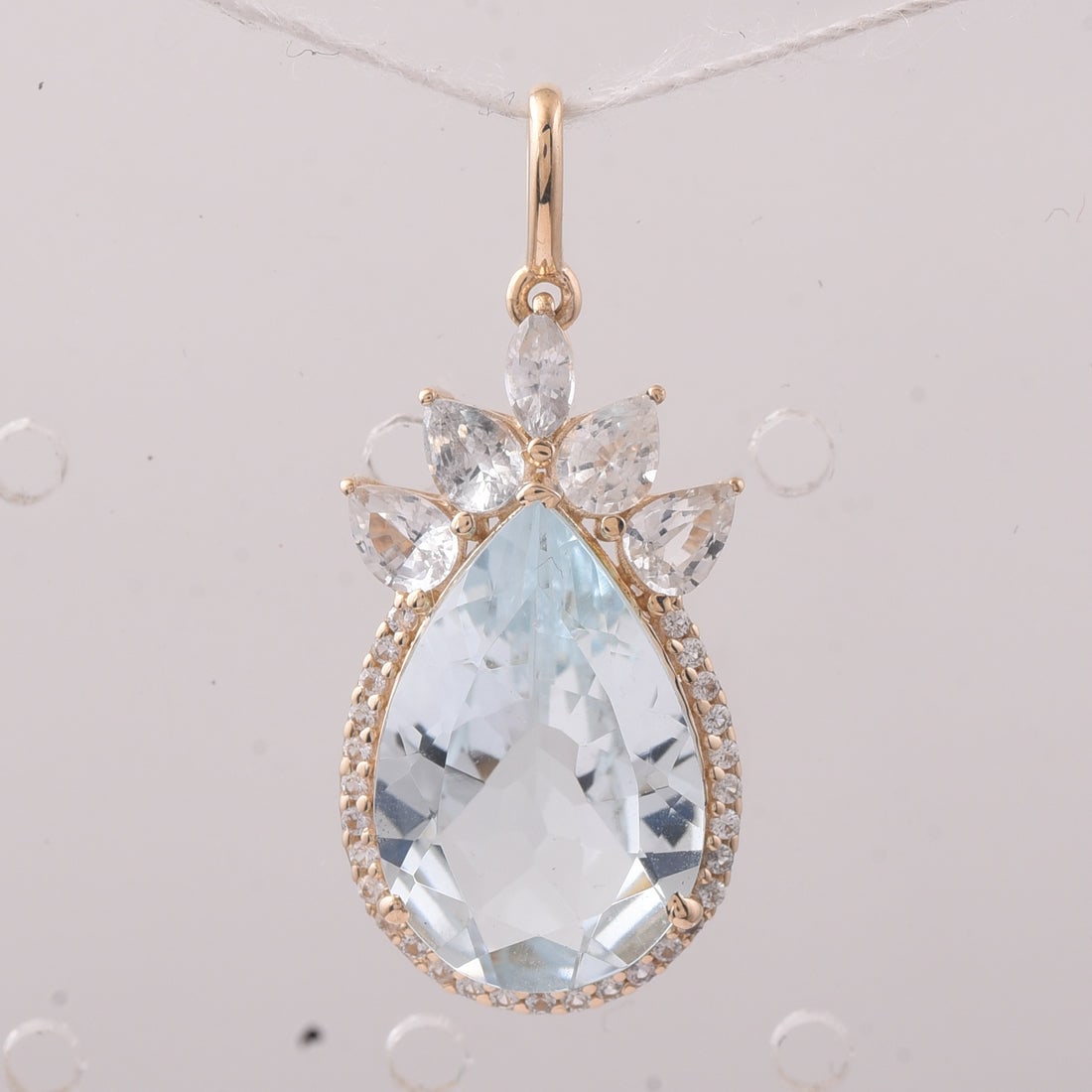 4.68 Ct Pear Aquamarine 9K Gold Pendant: 4.68 Total Carat Aquamarine 9K Gold Pendant Specifications: Total Weight 2.021 g Center Gemstone Aquamarine Gemstone Carat Weight 3.83 Carats Gemstone Measurements 15X10X5.20 mm Additional Gemstones