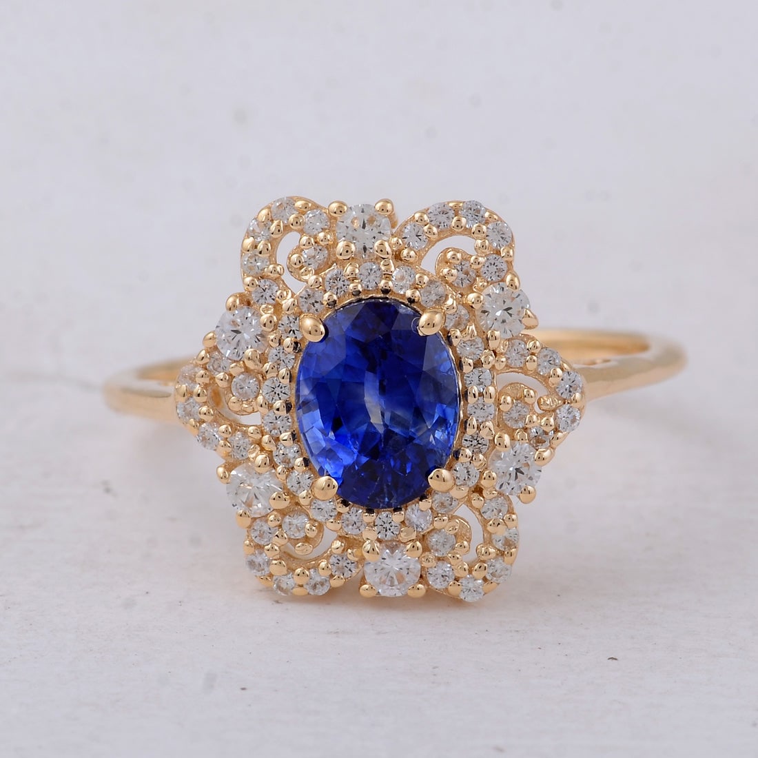 1.82 Ct Oval Sapphire 9K Gold Ring: 1.82 Total Carat Sapphire 9K Gold Ring Specifications: Total Weight 2.335 g Center Gemstone Sapphire Gemstone Carat Weight 1.39 Carats Gemstone Measurements 6.90X5.30X4.40 mm Additional Gemstones Whit