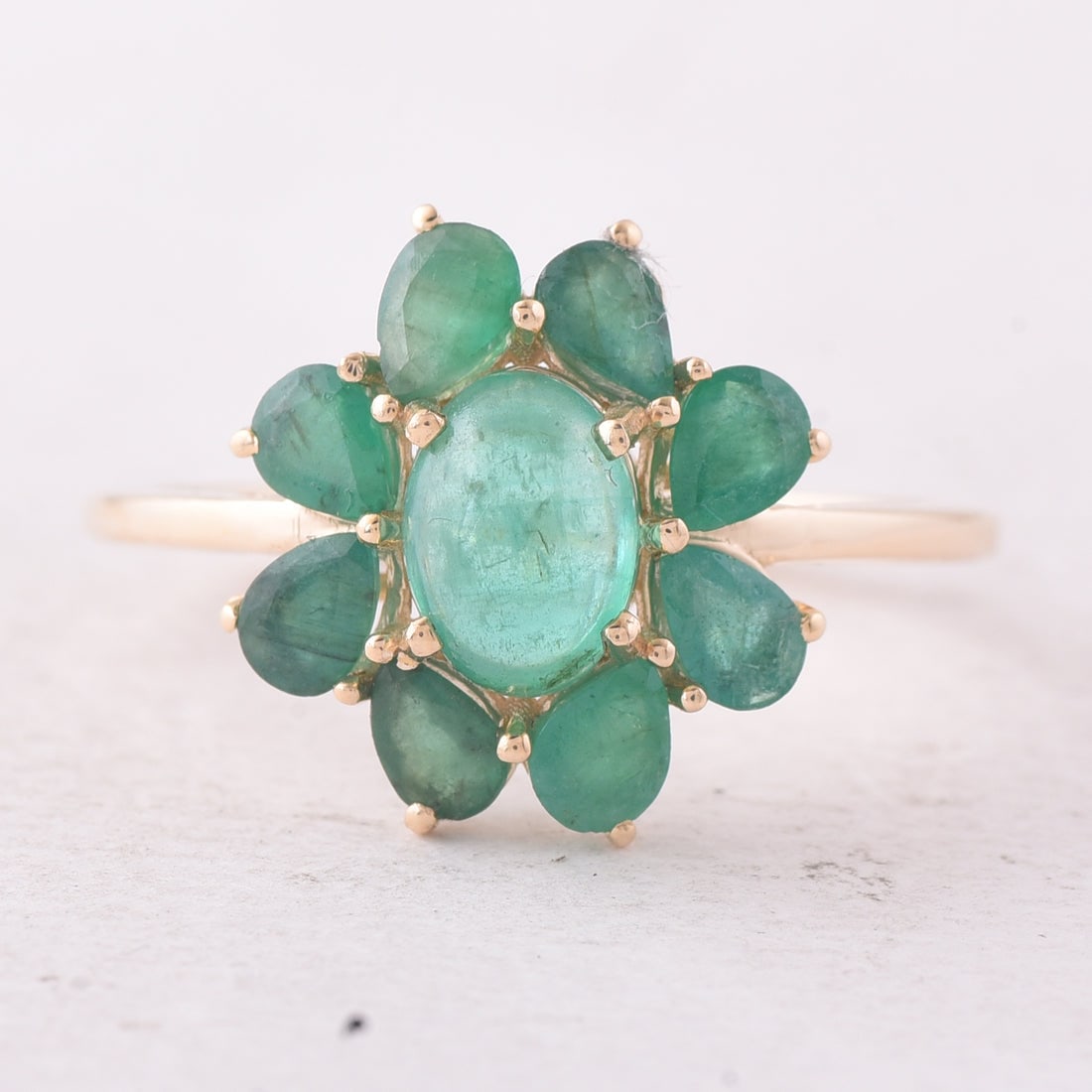 2.11 Ct Oval Emerald 9K Gold Ring: 2.11 Total Carat Emerald 9K Gold Ring Specifications: Total Weight 2.091 g Center Gemstone Emerald Gemstone Carat Weight 0.85 Carats Gemstone Measurements 7X5X3.70 mm Additional Gemstone Weight 1.26 C