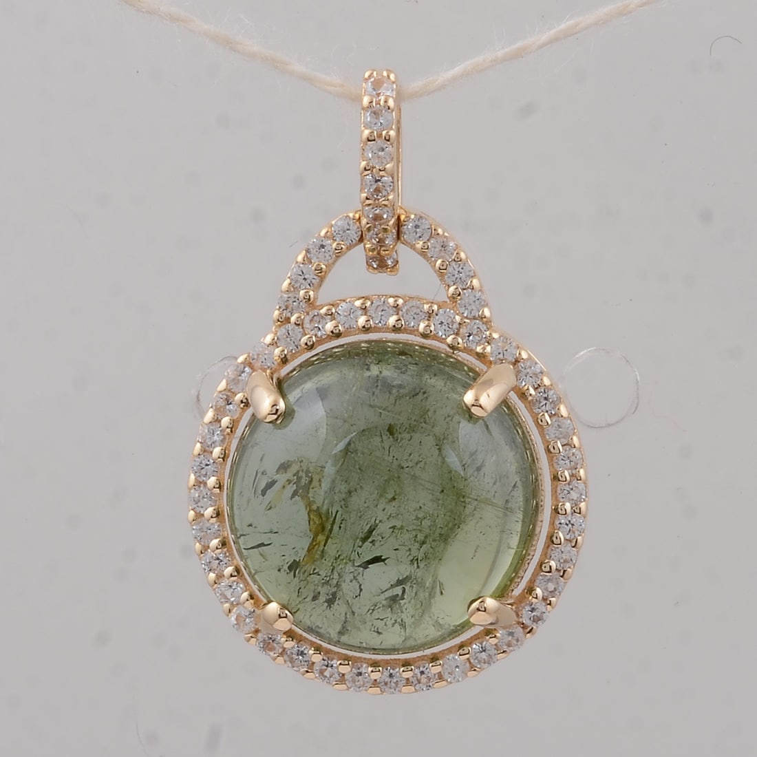 4.22 Ct Round Tourmaline 9K Gold Pendant: 4.22 Total Carat Tourmaline 9K Gold Pendant Specifications: Total Weight 1.73 g Center Gemstone Tourmaline Gemstone Carat Weight 4 Carats Gemstone Measurements 10X10X4.90 mm Additional Gemstones