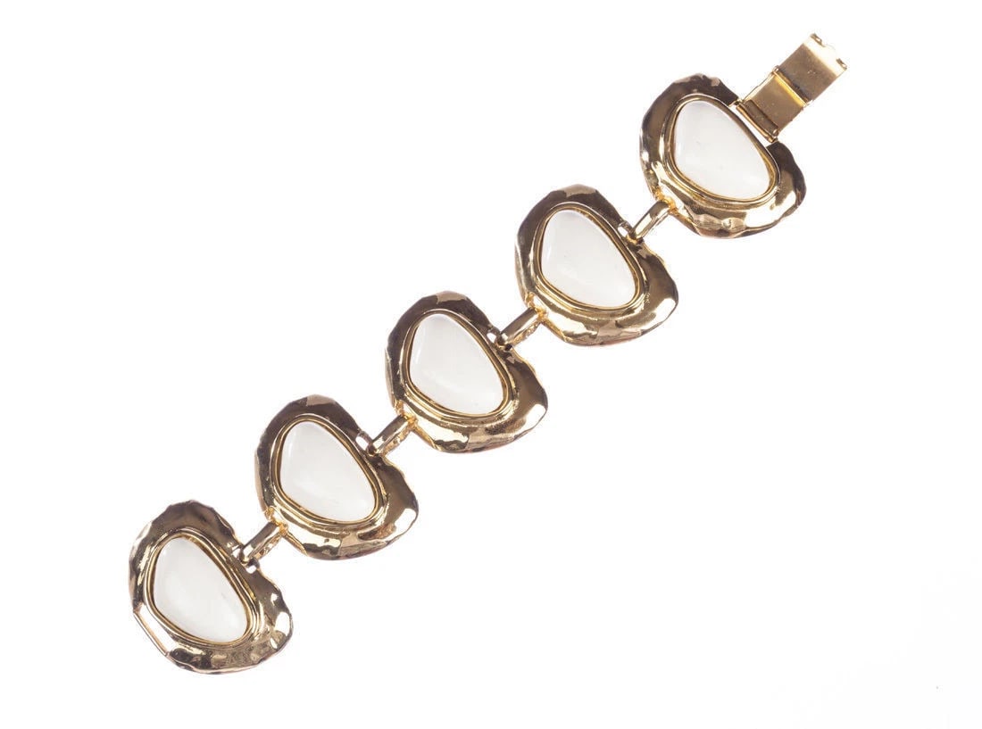 Massive Valentino Faux Nugget Coral Bracelet: Title:Massive Valentino Faux Nugget Coral Bracelet Description:Gorgeous faux white coral nugget cabochons and 18 kt gold plated bracelet by Valentino. Circa, 1970's. Bracelet measures 7 ½&rdquo