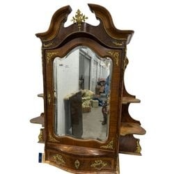 French Rococo Revival Burl Wood Mirrored Vanity/Dresser with Ormolu Mounts: This elegant French Rococo Revival vanity or dresser is crafted from beautifully figured burl wood, accented with decorative gilded ormolu mounts throughout. The piece features a central mirror with